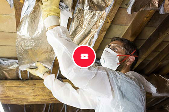 man surveying asbestos problems with a video icon on top