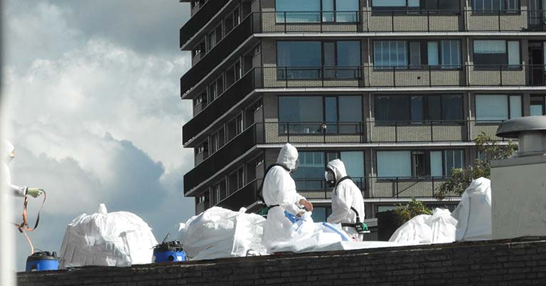 technicians removing asbestos